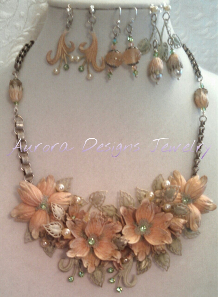 Beautiful peach and sage green assemblage with three pair of matching earrings.  This piece is at the top of my pyramid.  It's called "Point, Counterpoint".
